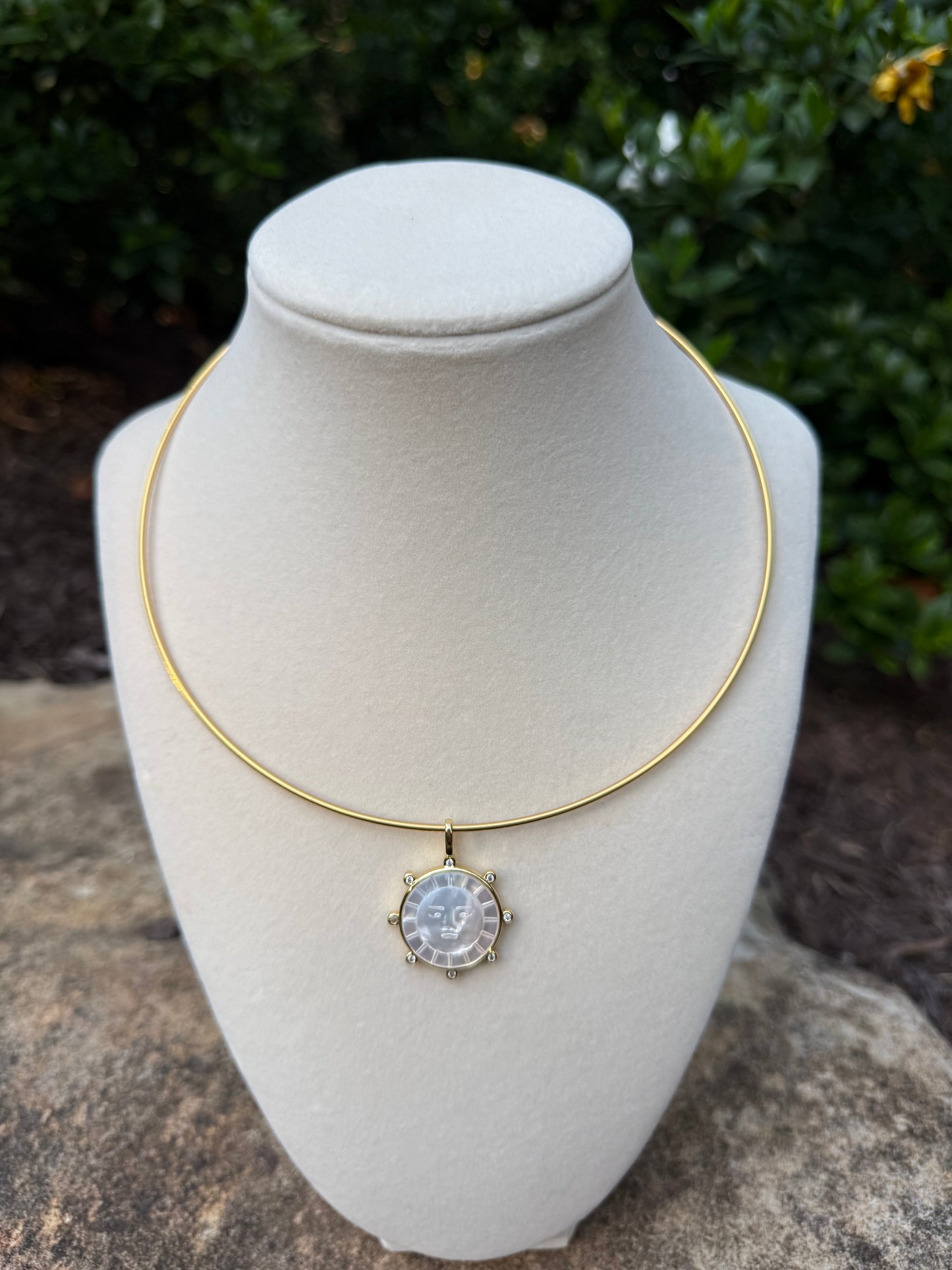 gold collar with sun charm