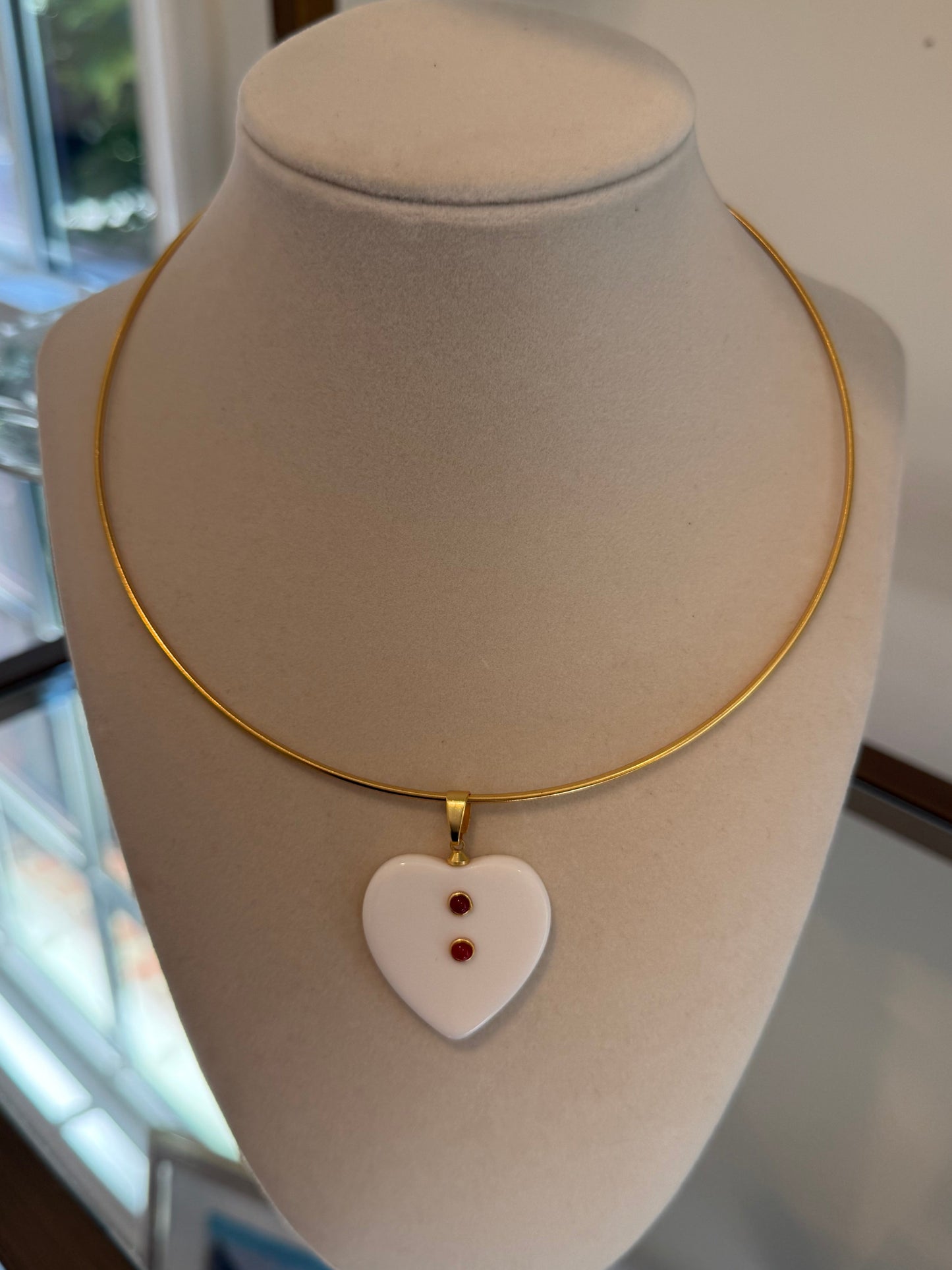 carnelian resin charm on gold collar
