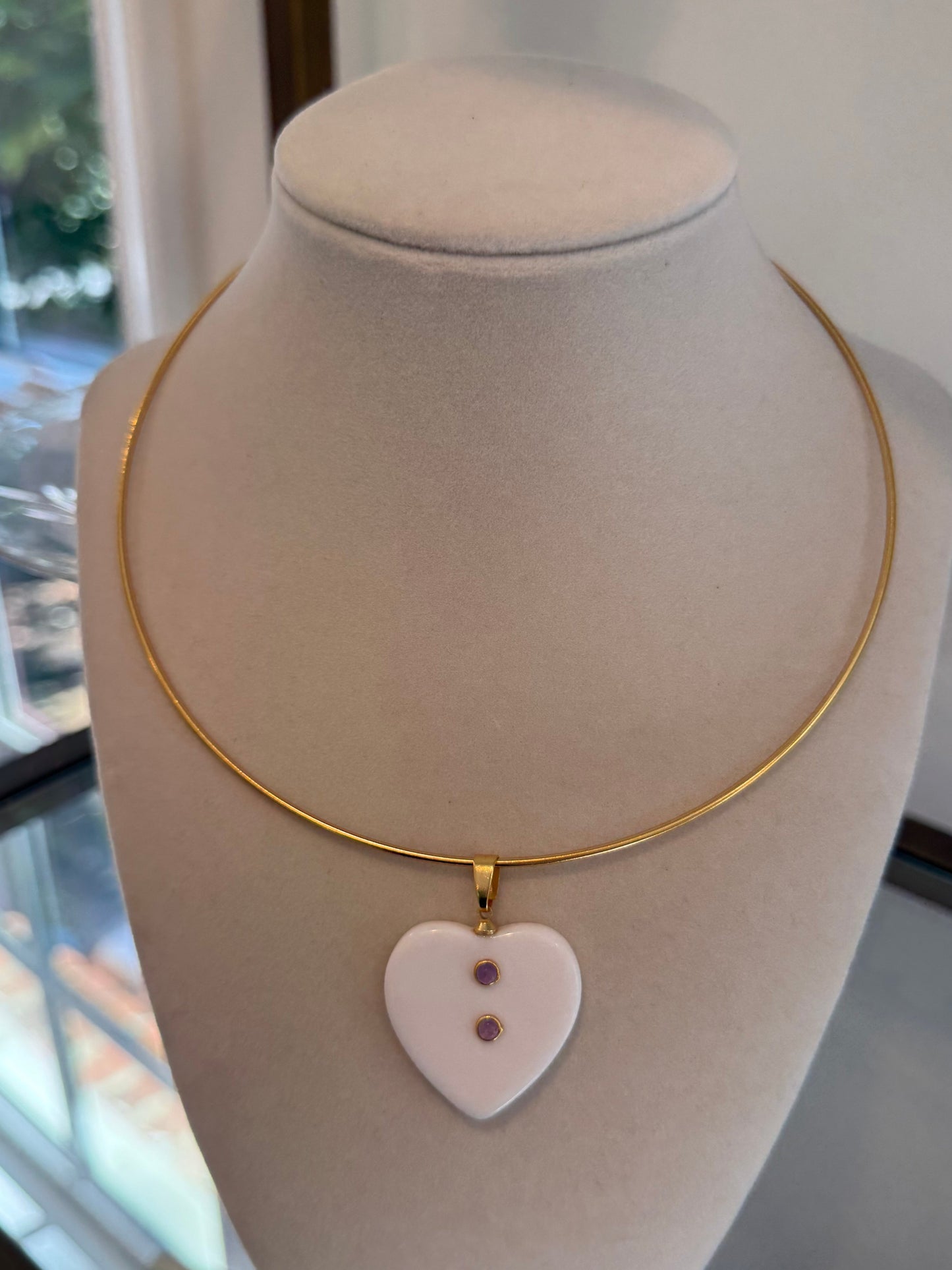 amethyst resin charm on gold collar